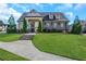 View of the clubhouse in a manicured community with healthy, green grass at 241 Irwell Path, Lawrenceville, GA 30044
