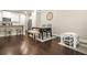 Open dining area adjacent to the kitchen, featuring a modern table, seating, and a play area at 241 Irwell Path, Lawrenceville, GA 30044