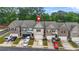 Charming exterior view of several townhomes, each with a private garage at 241 Irwell Path, Lawrenceville, GA 30044