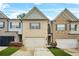 Charming townhomes feature brick exteriors, well-manicured lawns, and attached garages at 241 Irwell Path, Lawrenceville, GA 30044