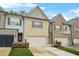 Charming townhomes feature brick exteriors, well-manicured lawns, and attached garages at 241 Irwell Path, Lawrenceville, GA 30044