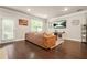Open concept living space with dark hardwood floors and recessed lighting at 241 Irwell Path, Lawrenceville, GA 30044