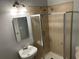Bathroom featuring a standing shower with glass door and pedestal sink at 490 Rockwell Sw St, Atlanta, GA 30310