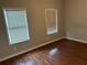 Bedroom with hardwood flooring and two windows providing ample natural light at 490 Rockwell Sw St, Atlanta, GA 30310