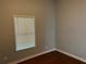 A bedroom shows a window letting in natural light that illuminates the hardwood flooring at 490 Rockwell Sw St, Atlanta, GA 30310