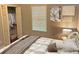 A bedroom with closet storage, window, and soft, natural lighting at 490 Rockwell Sw St, Atlanta, GA 30310