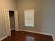 A bedroom with hardwood floors, closet, and natural light from a window at 490 Rockwell Sw St, Atlanta, GA 30310