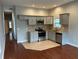 Modern kitchen featuring stainless steel appliances, granite countertops, and gray cabinetry at 490 Rockwell Sw St, Atlanta, GA 30310