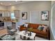 Cozy living room connected to kitchen features modern furniture, decor, and natural light at 490 Rockwell Sw St, Atlanta, GA 30310