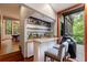 Entertain guests with a bar, granite countertops, wine racks, and outdoor deck access with a grill at 5120 Jett Forest Trl, Atlanta, GA 30327