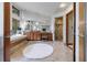 Luxurious bathroom featuring a soaking tub, tiled shower, and wooden vanity at 5120 Jett Forest Trl, Atlanta, GA 30327
