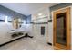 This updated bathroom features a marble floor, modern vanity, and a shower/tub combo with glass doors at 5120 Jett Forest Trl, Atlanta, GA 30327