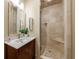 Modern bathroom with a glass-enclosed tiled shower, a sleek vanity, and stylish fixtures at 5120 Jett Forest Trl, Atlanta, GA 30327
