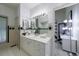 Bright bathroom with white cabinets, mosaic tile and an attached office area providing versatile spaces at 5120 Jett Forest Trl, Atlanta, GA 30327