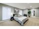 This bedroom has wall-to-wall carpeting, great natural light, and modern furnishings at 5120 Jett Forest Trl, Atlanta, GA 30327