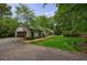 Beautiful home featuring a driveway, well-manicured lawn, and a charming garage at 5120 Jett Forest Trl, Atlanta, GA 30327