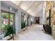 Bright and spacious hallway with sleek tiled floors, stone accent wall and modern lighting at 5120 Jett Forest Trl, Atlanta, GA 30327