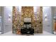 Stunning foyer featuring a floor-to-ceiling stone accent wall and modern decor at 5120 Jett Forest Trl, Atlanta, GA 30327