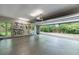Spacious garage with epoxy floors, natural lighting, and bike storage system at 5120 Jett Forest Trl, Atlanta, GA 30327