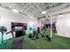 This home gym has an artificial turf floor and modern exercise equipment at 5120 Jett Forest Trl, Atlanta, GA 30327