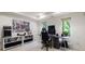 The carpeted home office features built-in bookshelves and a large window to the backyard at 5120 Jett Forest Trl, Atlanta, GA 30327