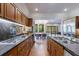 Spacious kitchen with granite counters, stainless steel appliances, and ample cabinet space at 5120 Jett Forest Trl, Atlanta, GA 30327