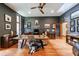 This home office features hardwood floors, lots of natural light, and unique decorations and art at 5120 Jett Forest Trl, Atlanta, GA 30327