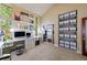 Sunlit studio showcasing ample storage and multiple workspaces that overlook a lush view at 5120 Jett Forest Trl, Atlanta, GA 30327
