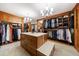 Spacious walk-in closet with an island and custom shelving at 5120 Jett Forest Trl, Atlanta, GA 30327