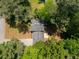 Overhead view of the home's roof, surrounded by lush, mature trees and greenery at 157 Jousters Ln, Lawrenceville, GA 30044
