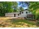 Expansive backyard featuring patio, well-maintained lawn, and the home's exterior at 157 Jousters Ln, Lawrenceville, GA 30044