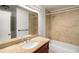 Bathroom with a vanity, granite countertop, and tiled tub/shower at 157 Jousters Ln, Lawrenceville, GA 30044