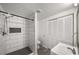 Bathroom with a tiled shower, and a closet with folding doors at 157 Jousters Ln, Lawrenceville, GA 30044