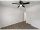 A naturally lit bedroom featuring laminate floors, a ceiling fan and a closet at 157 Jousters Ln, Lawrenceville, GA 30044