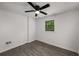 A bedroom offering natural light, a ceiling fan and gray laminate floors at 157 Jousters Ln, Lawrenceville, GA 30044