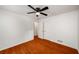 Bedroom with hardwood floors, ceiling fan, and closet at 157 Jousters Ln, Lawrenceville, GA 30044