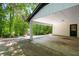 Covered carport with brick pillar and direct access to the house, offering convenience at 157 Jousters Ln, Lawrenceville, GA 30044