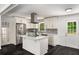 Bright kitchen with stainless steel appliances, white cabinets, and marble countertops at 157 Jousters Ln, Lawrenceville, GA 30044