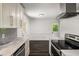 Well-lit kitchen featuring granite countertops, stainless steel appliances, and an open design at 157 Jousters Ln, Lawrenceville, GA 30044