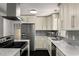 Stylish kitchen featuring stainless steel appliances, granite countertops, and ample cabinet space at 157 Jousters Ln, Lawrenceville, GA 30044