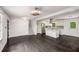 Spacious living area with hardwood floors, staircase access, and seamless kitchen integration at 157 Jousters Ln, Lawrenceville, GA 30044