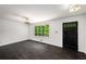 Inviting living room featuring hardwood floors, natural light, and a modern ceiling fan at 157 Jousters Ln, Lawrenceville, GA 30044
