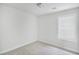 Cozy bedroom featuring neutral carpet, white walls, base trim, and a bright window at 332 Christian Ln, Carrollton, GA 30116