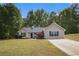 Charming single story home featuring well-maintained landscaping and a long driveway at 332 Christian Ln, Carrollton, GA 30116