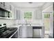 Kitchen featuring stainless steel appliances and granite countertops at 332 Christian Ln, Carrollton, GA 30116