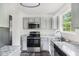 Modern kitchen featuring stainless steel appliances, granite countertops, and lots of natural light at 332 Christian Ln, Carrollton, GA 30116