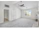 Spacious living room featuring neutral colored carpet and entryways to other rooms at 332 Christian Ln, Carrollton, GA 30116