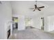 Bright living room with a fireplace, ceiling fan and neutral walls at 332 Christian Ln, Carrollton, GA 30116