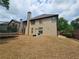 The backyard features a patio and a wooden fence for privacy at 3943 Dunaire Dr, Stone Mountain, GA 30083