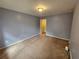 Spacious bedroom with plush carpeting and natural light; closet not pictured at 3943 Dunaire Dr, Stone Mountain, GA 30083